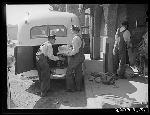 Montrose, Colorado, is junction point for standard gauge and narrow gauge railroads and bus lines. Papers and mail are being loaded into bus for transporting to towns along the route