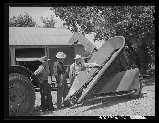 Committee of Cornish machinery cooperative looking over equipment which they will buy. Preston, Idaho