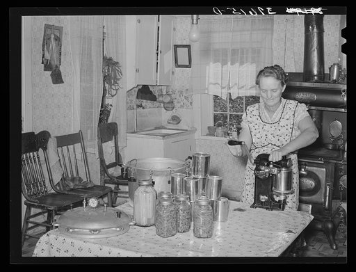 Mrs. Christiansen of the Christiansen canning unit sealing cans. During 1939 she canned 2300 quarts which included 20 mutton, 2 deer, 2 beeves, 5 pigs. Fish was tried very successfully. In this cooperative agreement there were twenty-five users and outside of the cooperative there were ten others wh