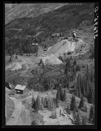 Abandoned gold mines and mills with piles of tailings in San Juan County, Colorado. The results of excessive cutting of timber can be plainly seen