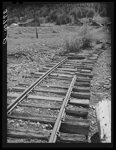 Abandoned railroad leading to abandoned mine. San Juan County, Colorado. When the mines moved out, whole towns and affiliated industries folded up