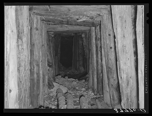 Timber-shored tunnel into mine, San Juan County, Colorado. Much timber is required in mine tunnel construction and mill work
