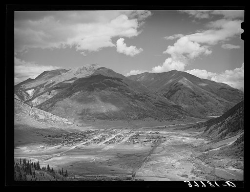 Untitled photo, possibly related to: Silverton, Colorado lies in a valley at 9400 feet elevation. This has been a center for mining and milling operations and the tailing-choked Animas River can be seen at left