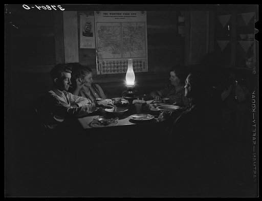 Farm family after evening meal. Pie Town, New Mexico
