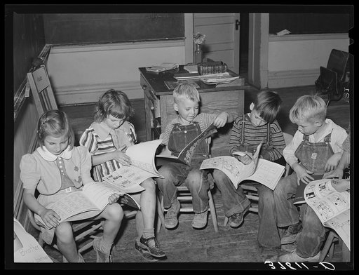 Children looking at picture books at school, Santa Clara, Utah. See general caption