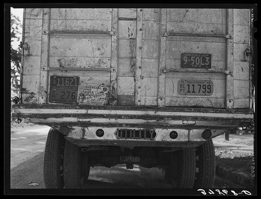 License plates on rear of produce truck. Santa Clara, Utah. See general caption