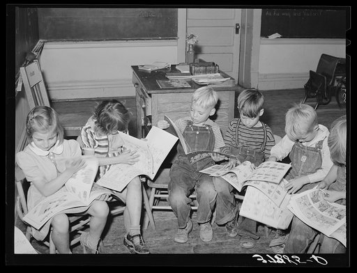 Untitled photo, possibly related to: Children looking at picture books at school, Santa Clara, Utah. See general caption