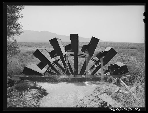 FSA (Farm Security Administration) cooperative waterwheel near little field. Mohave County, Arizona