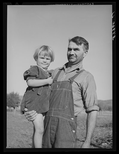 John Frost and his daughter. Mr. Frost is part owner of 135 acres of semi-marginal land in Tehama county, California. He has a family of seven. His crops are turkeys, hogs and dairy cattle, he is a FSA (Farm Security Administration) client