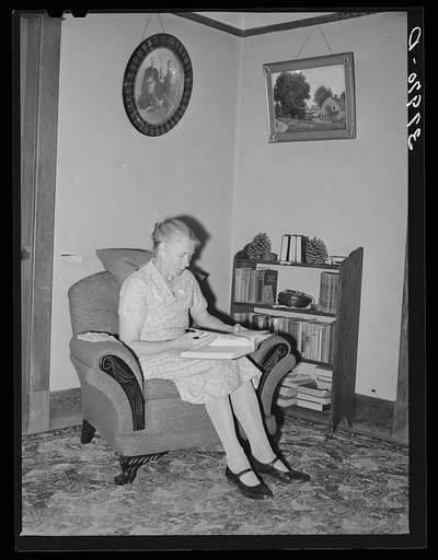 Wife of Elof Hansen in living room of her farm home. He is a small farmer in Yuba County, California