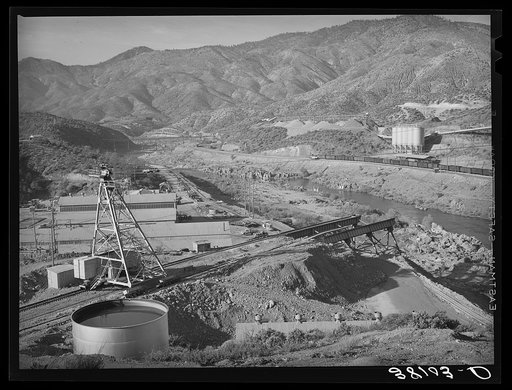 Some of the construction work immediately below Shasta Dam, on the Sacramento River. Shasta County, California
