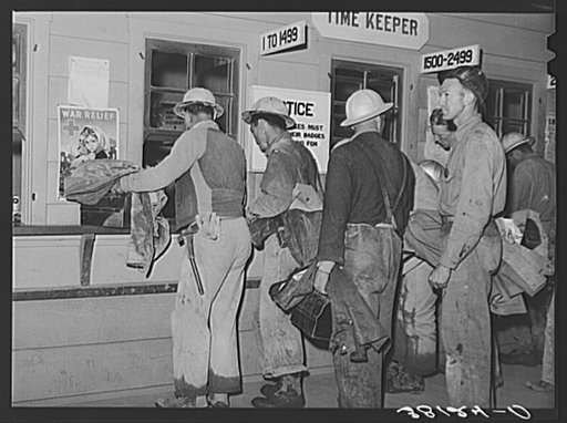 Construction workers being paid off. Shasta Dam, Shasta County, California