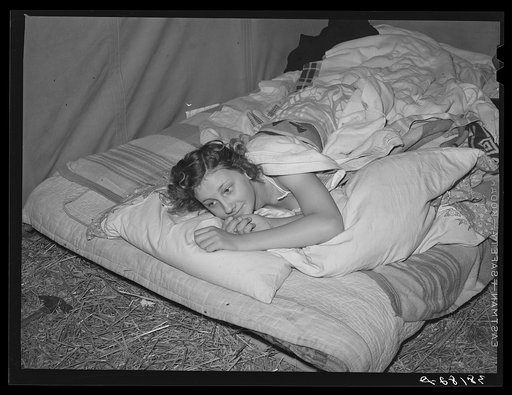 Daughter of carpenter in her tent home. Mission Valley, California, which is about three miles from San Diego. She was in the second year of high school in Louisiana, but she is not attending school in California