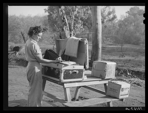Carpenter's wife unpacking a trunk. Mission Valley, California, which is about three miles from San Diego