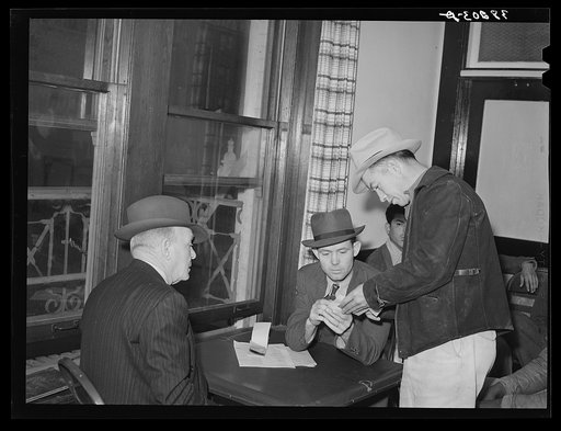 Dispatching men to work at the union headquarters. San Diego, California. Substantially all defense construction and airplane work is unionized in San Diego. Thus, the union headquarters is a key employment spot