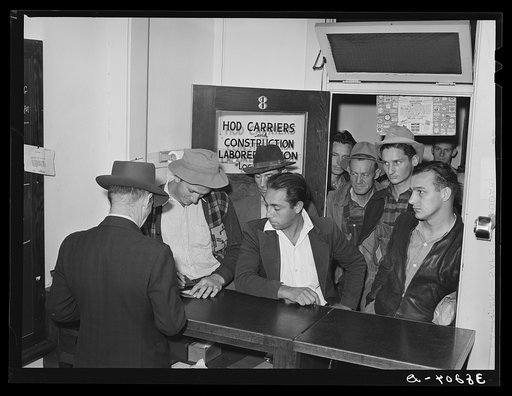 Lineup of workmen at union headquarters, San Diego, California, after the first batch of men are dispatched in the morning. Those remaining stand in line awaiting subsequent calls during the day
