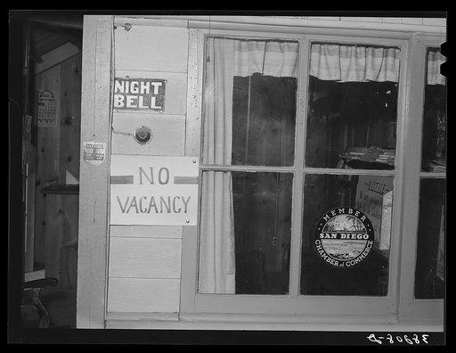 "No Vacancy" sign hung out at tourist court. San Diego, California