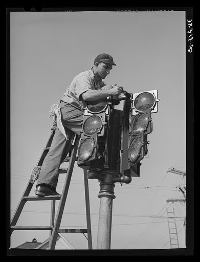 Putting up new traffic signal. San Diego, California