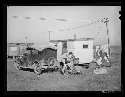 Automobile and trailer parked in trailer court. These belong to a carpenter's helper who is from the Rio Grande Valley. He owns his home in the valley, has done farm work and public work there. His family is with him in Corpus Christi where he is now working at the naval air base