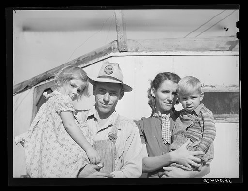 Family of carpenter's helper who lives in their trailer. Corpus Christi, Texas