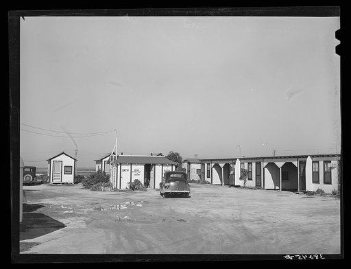 Tourist court showing the sanitary facilities building. Corpus Christi, Texas. These tourist courts are now filled with workmen from the naval air base