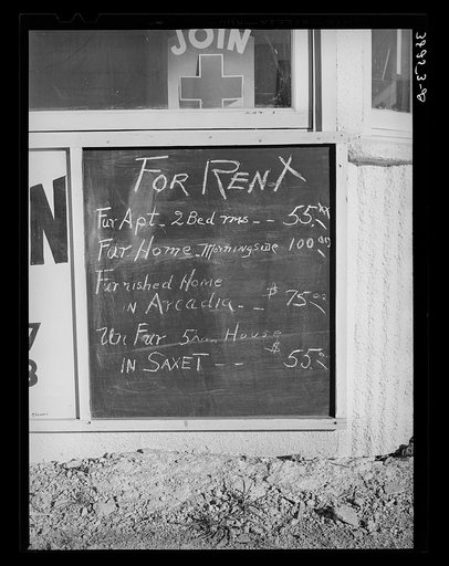 Sign in front of real estate office which shows the rent scale. Corpus Christi, Texas