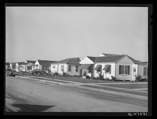 Houses in the Alameda residential section of Corpus Christi, Texas. These houses are about two years old and were built by people who came into Corpus Christi because of the oil boom, sea wall construction work, etc. This is the type of housing which is greatly needed for naval officers and their fa