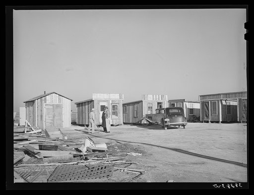 Untitled photo, possibly related to: Tourist courts built of second hand lumber. Corpus Christi, Texas. These are on North Beach and were constructed to accommodate workmen at the naval air base
