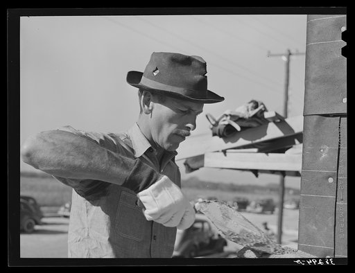 White bricklayer, Corpus Christi, Texas. He is working on a U.S.H.A. project which is constructing two hundred forty-nine units for married enlisted men and civilian employees