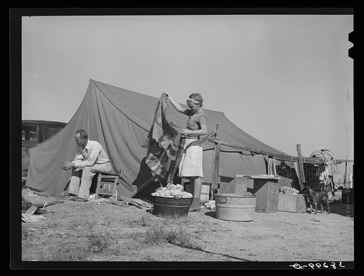 Roofer and his daughter in front of tent home. Corpus Christi, Texas. This man has been working at the naval air training base but hurt his back a week ago and is now unable to work. Roofers draw one dollar per hour but are laid off during bad weather; consequently, the last week he worked he made o