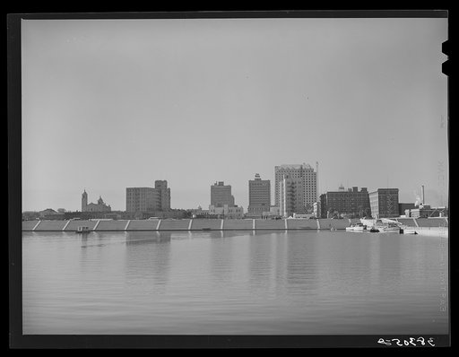 Business district of Corpus Christi, Texas, with the two million dollar seawall which is now being constructed in the foreground