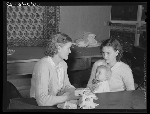 Sewing lesson at the Yuba City FSA (Farm Security Administration) farm workers' camp. Yuba City, California