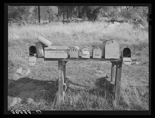 Mail boxes near Auburn, California. Notice the Japanese name. The Japanese are moving into this section on a subsistence farming basis as the older settlers who have not adjusted themselves to changing market conditions move out. Placer County, California