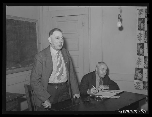 Farmers meeting with agricultural agent. Gold Hill, Placer County, California