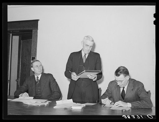 Officers of the Loomis Fruit Association cooperative at their fortieth annual meeting. Loomis, California. The 1940 season was reported to have been their most difficult season. They attributed this to hail-damaged fruit, new government regulations and taxations. "If association is slow in getting o