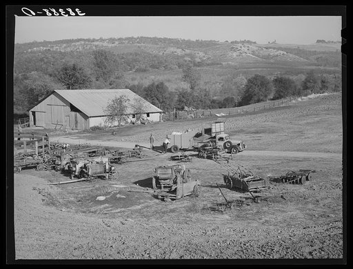Barn and farm equipment of fruit farmer. Placer County, California. Notice the spraying carts