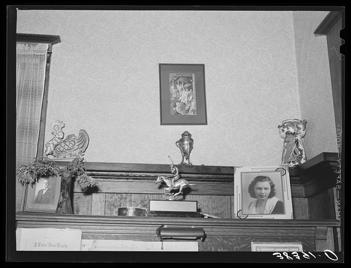 Ornaments on top of piano in living room of fruit farmer. Placer County, California. These farmers have had a very high living standard. Center figure is award this farmer's daughter helped win in polo match