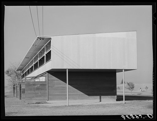 Row of apartments for permanent farm workers at the Yuba City farm workers' camp. Yuba City, California