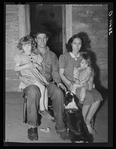 Young man, his wife and children. They came from Oklahoma with his father and mother. His father has bought a farm and expects to get some cash from his fruit and supplement his income with garden, pigs and chickens, a thing unheard of in this section of fruit specialists. Placer County