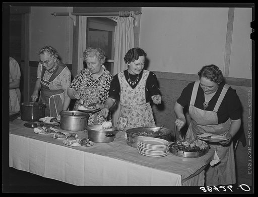 Dishing up dinner for the members of the Loomis Fruit Association cooperative who are holding their fortieth annual meeting. Loomis, California.  Placer County