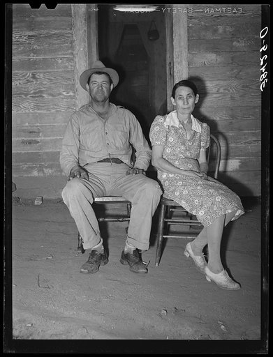 Oklahoma farmer and his wife who have moved to California. First they picked cotton as migrant workers, then rented a farm and have now bought the thirty-eight  acre farm through the Federal Land Bank. Placer County, California