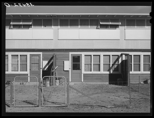 Untitled photo, possibly related to: Back of apartment building for permanent farm workers at the Yuba City farm workers' camp. Yuba City, California