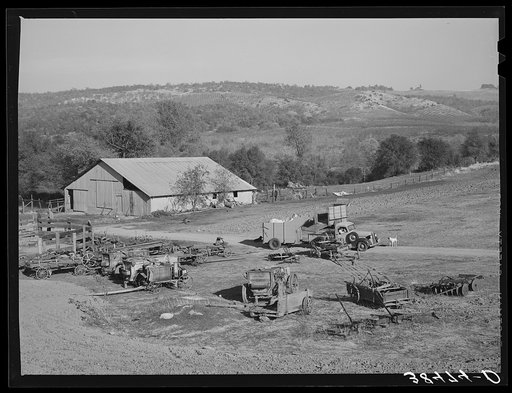 Untitled photo, possibly related to: Barn and farm equipment of fruit farmer. Placer County, California. Notice the spraying carts