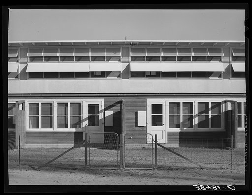 Back of apartment building for permanent farm workers at the Yuba City farm workers' camp. Yuba City, California