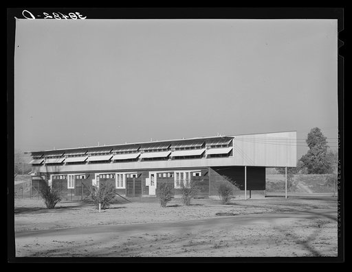 Row of apartments for permanent farm workers at the Yuba City farm workers' camp. Yuba City, California