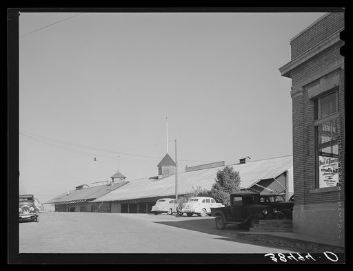 Corner of Bank of America and packing sheds of the Earl Fruit Company. New Castle, California