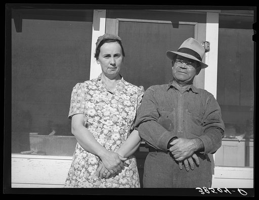 Fruit farmer and his wife, Placer County, California. This couple have changed the varieties of fruit which they grow to meet changed market conditions; they also have garden, pigs, cows, etc. He paid seventy-four thousand dollars for his one hundred fifty acres today and is in fair conditions today