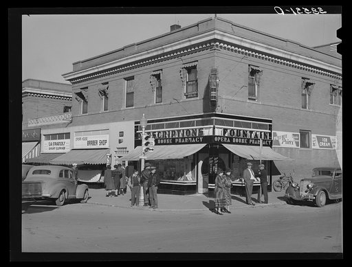 Untitled photo, possibly related to: Chain stores on main street of La Junta, Colorado