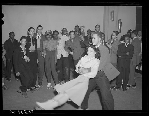 Negro swinging his girl on roller skates. Savoy Ballroom, Chicago, Illinois