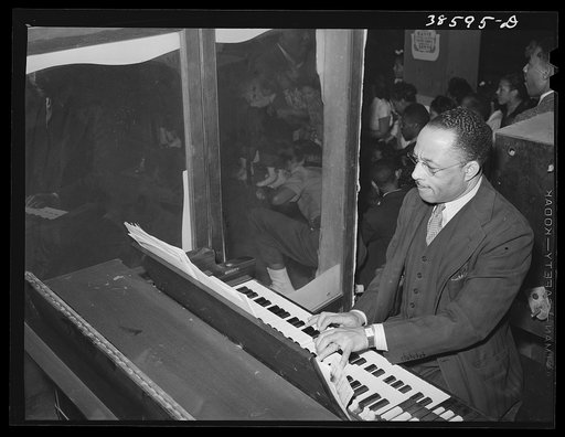 The organist at Negro rollerskating rink. Chicago, Illinois